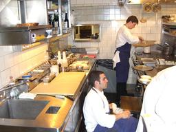Photo of two people working in the French Laundry kitchen